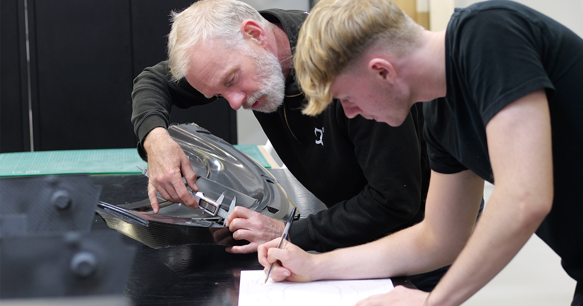 A TECNIQ apprentice and experienced engineer look at technical drawing